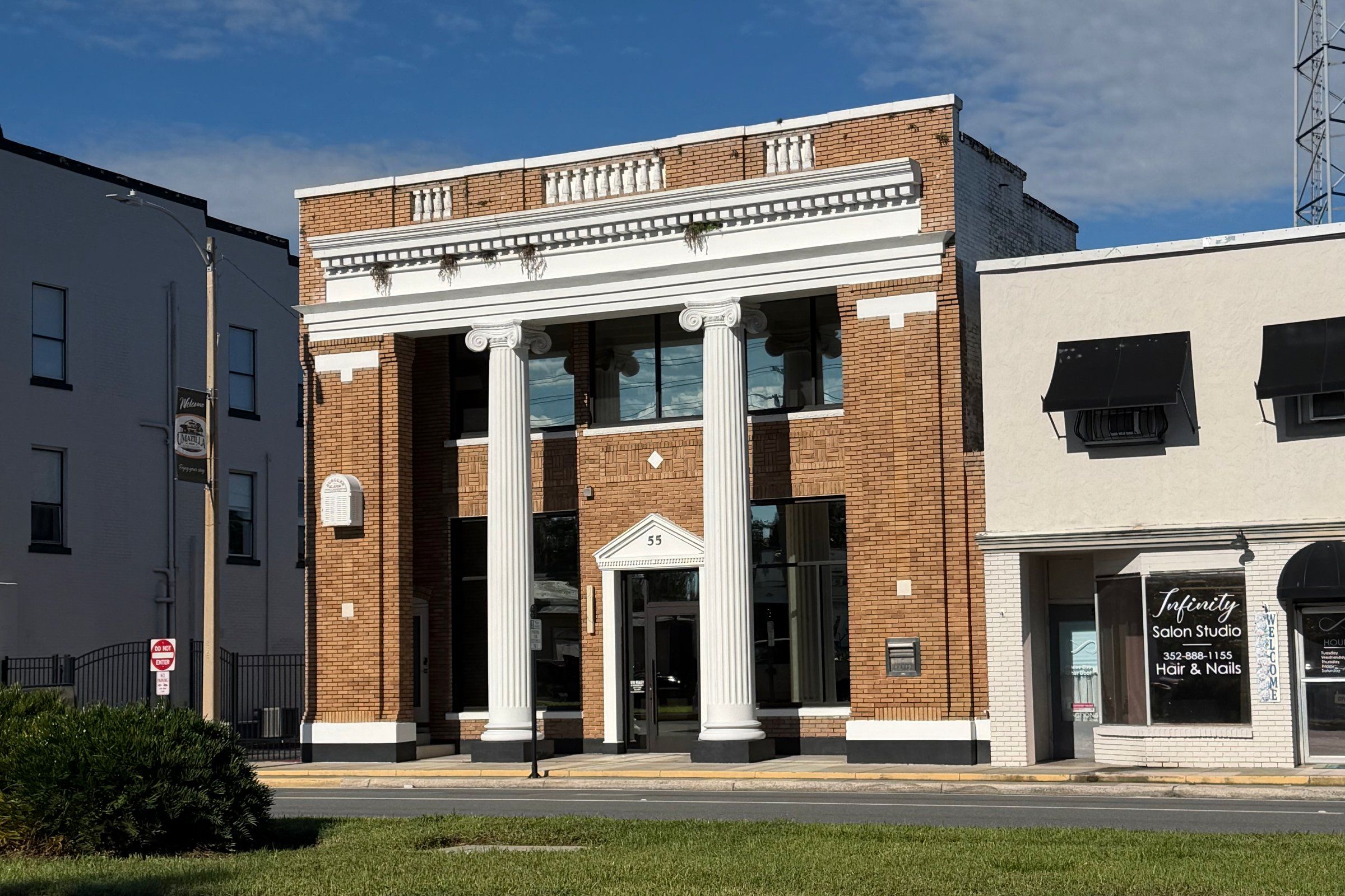 RLW Realty's office, a historic columned building at 55 N. Central Avenue in downtown Umatilla